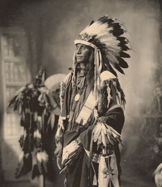 Native American Surrounded by Smoke | Photo by Boston Public Library