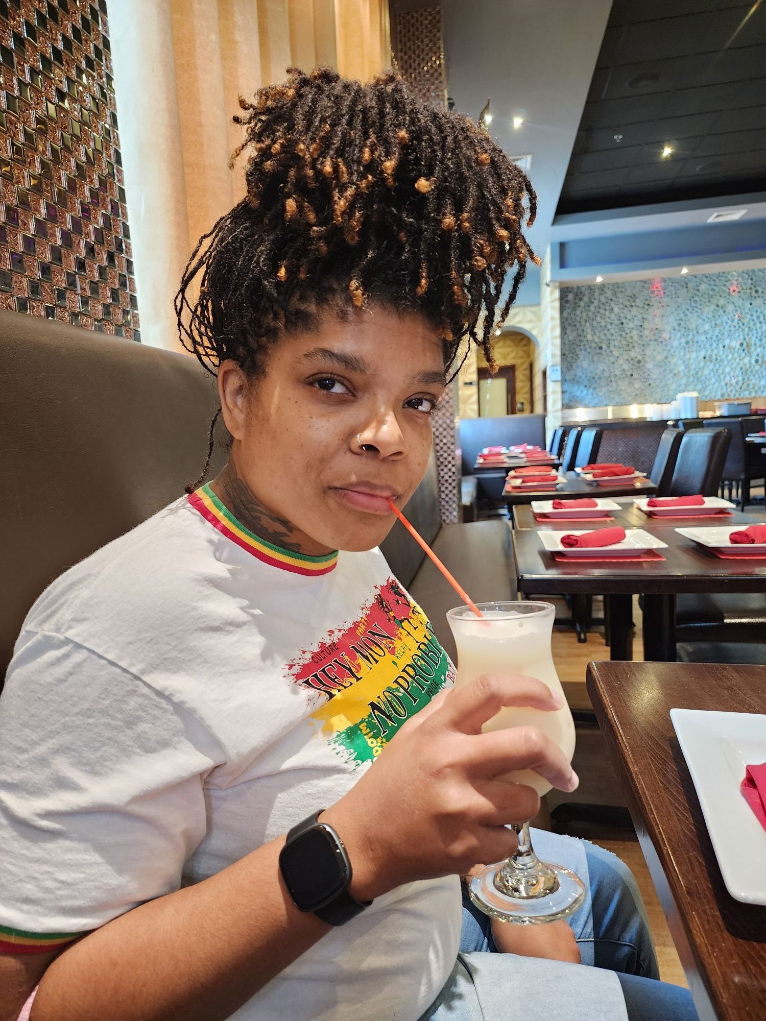 Deniece sipping on a virgin pina colada